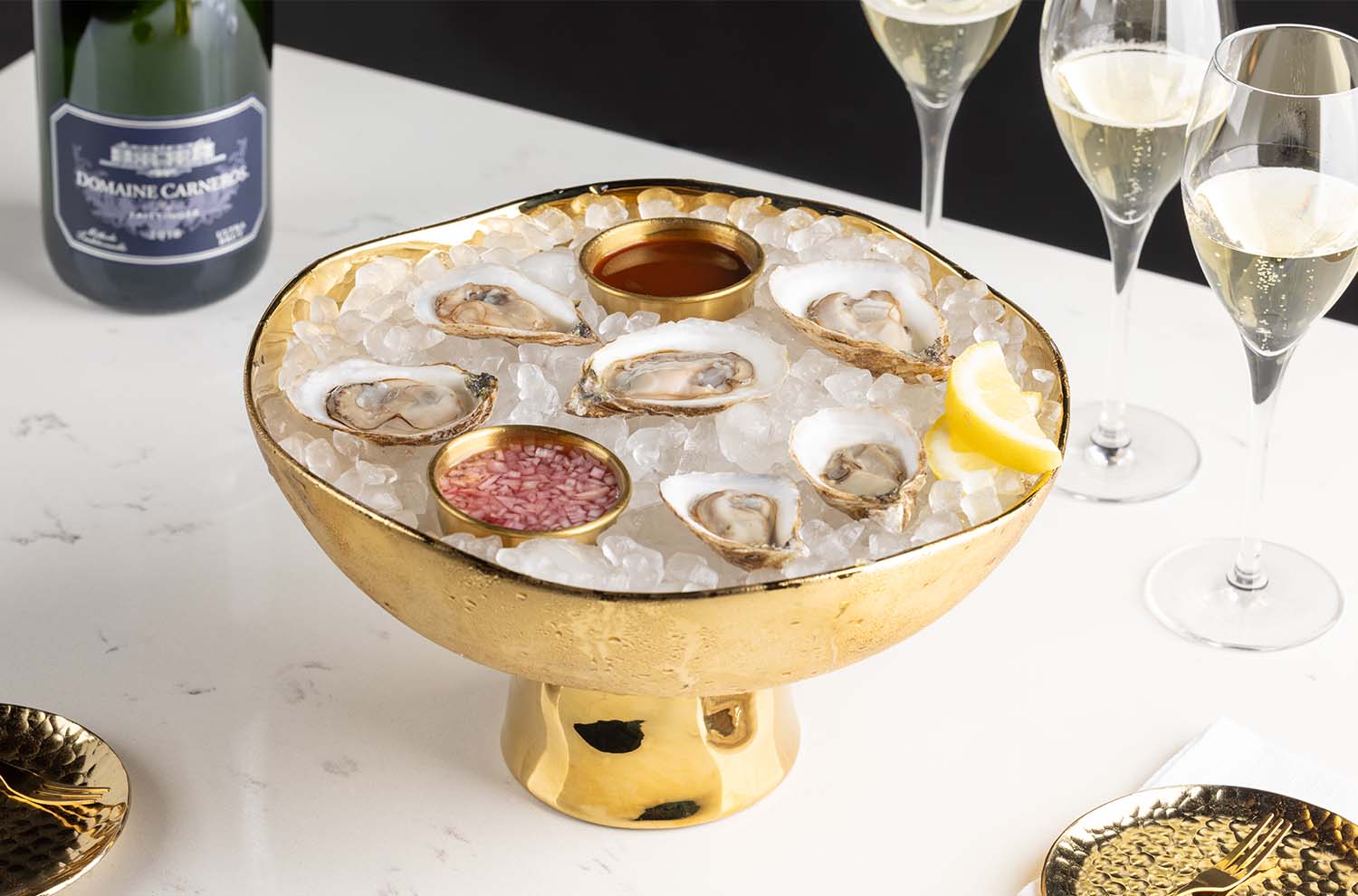photo of oysters and glasses of sparkling wine