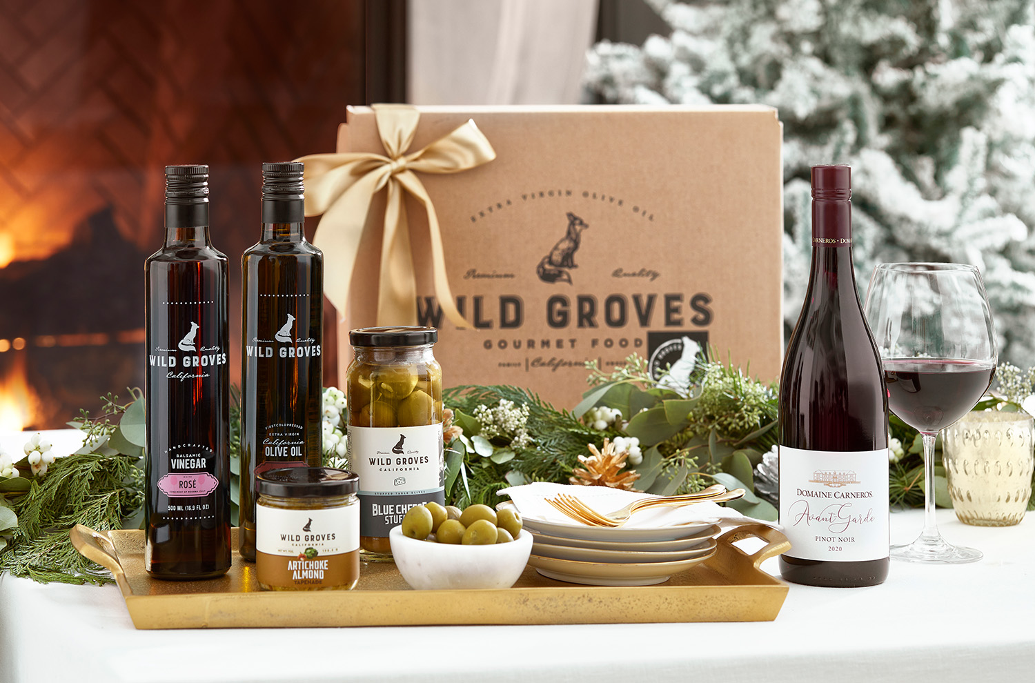Wild Groves Box and Domaine Carneros Pinot Noir in front of fire