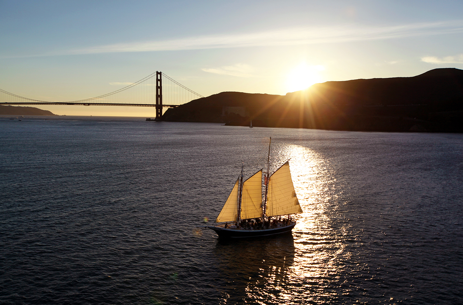 ship sailing with the San Francisco Golden Gate Bridge in background