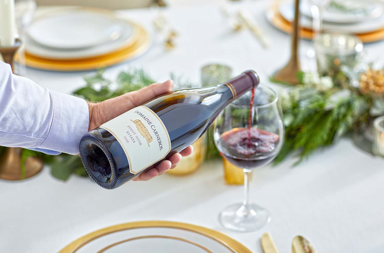 red wine being poured into a glass