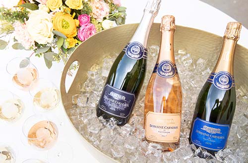 Ultra Brut, Brut Rose, and Estate Brut in Ice Bucket with florals