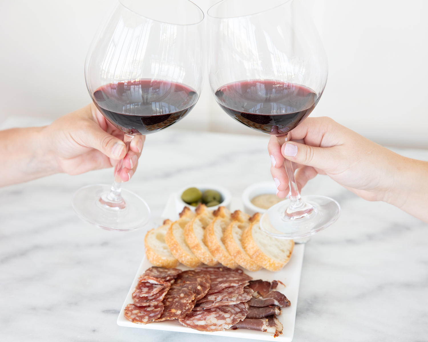 2 friends making a toast with red wine