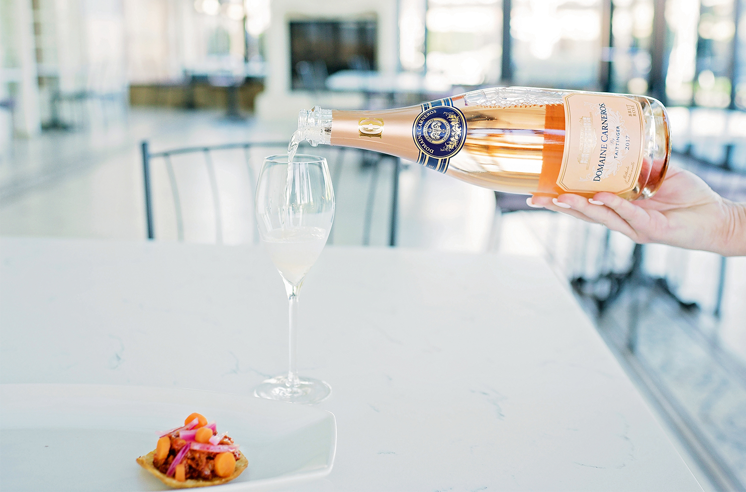 Chicken Pibil and someone pouring a glass of Brut Rose